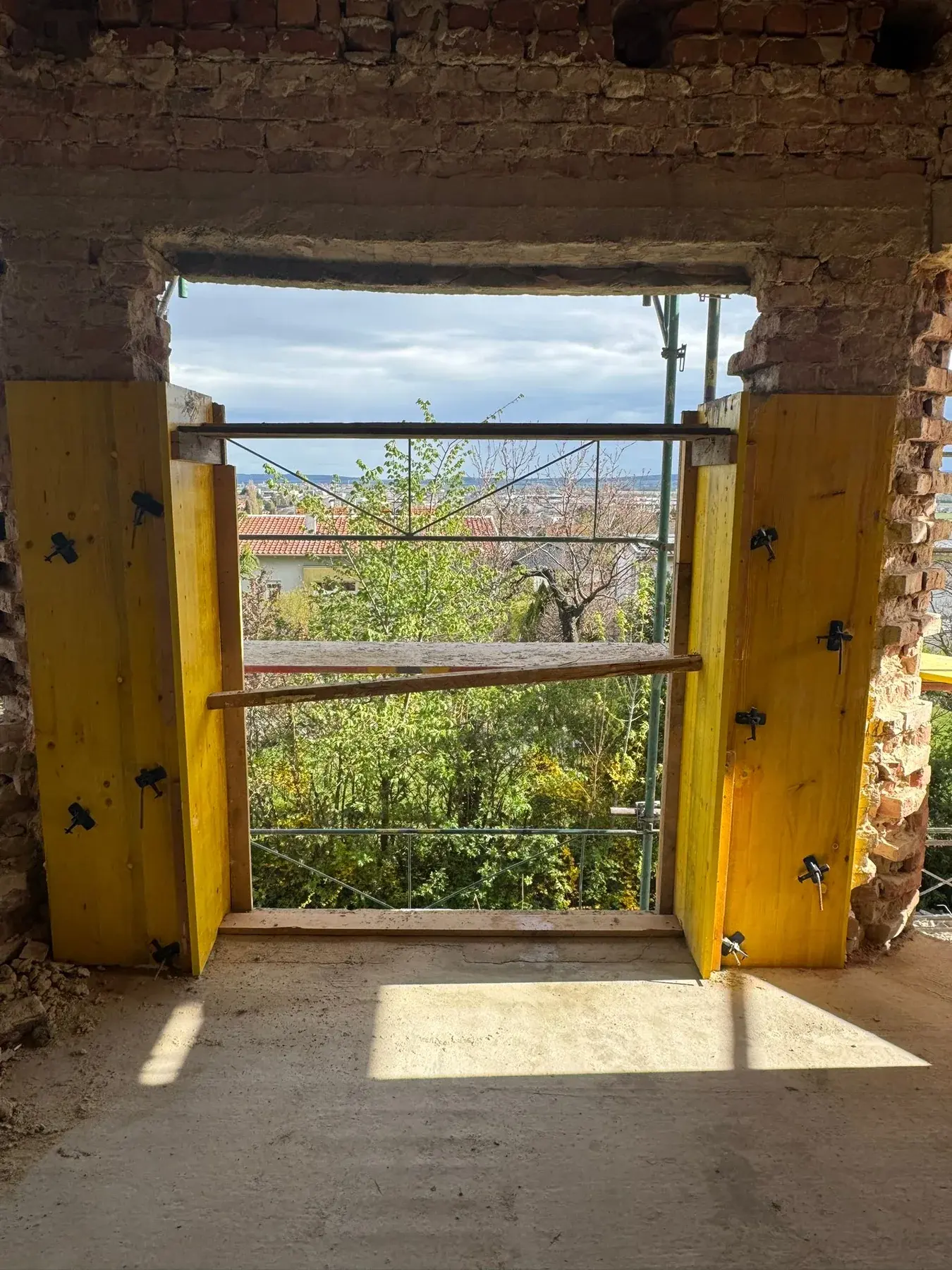 Refurbishment work with exposed building substance around a window opening